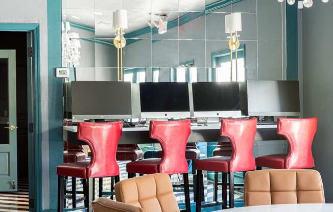 a dining room with a chandelier and chairs