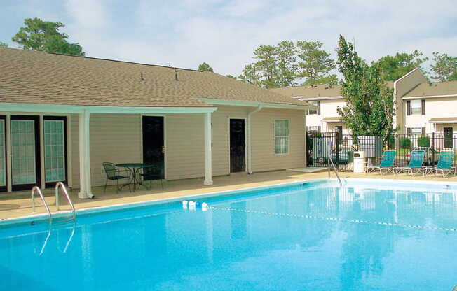 pool and lounge chairs behind leasing center at Autumn Chase