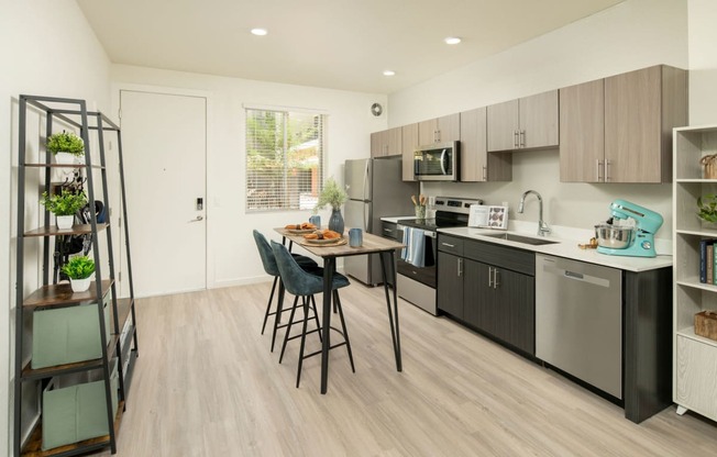 a kitchen and dining area in a 555 waverly unit