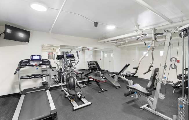 Fitness Facilities complete with various exercise equipment and television at King Arthurs Court, Seattle, WA, 98125