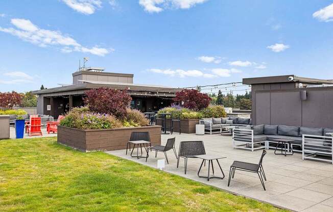 A patio area with a table and chairs.
