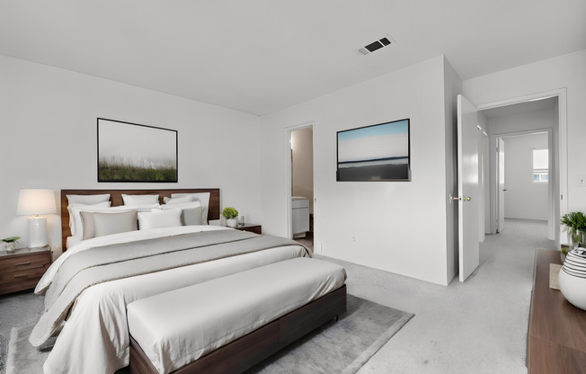rendering of a furnished bedroom with large bed and dresser and access to master bathroom