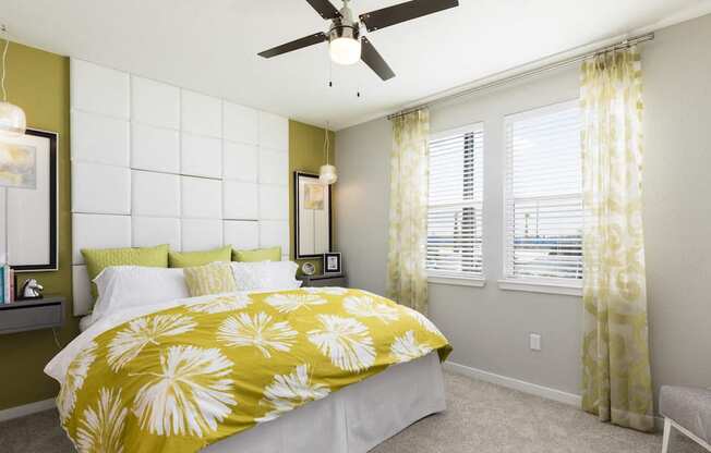 model bedroom with designer fan and large windows