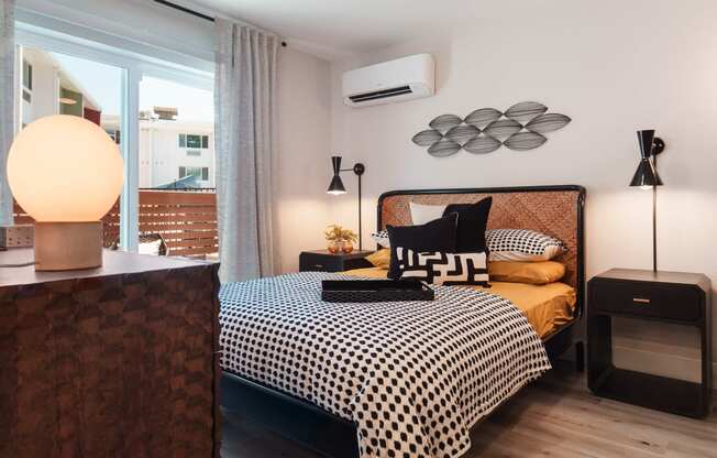 a bedroom with a bed and a ceiling fan