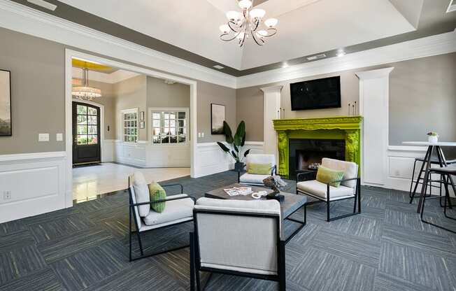 Modern clubhouse with fireplace  located at St. Andrews Apartments in Johns Creek, GA 30022