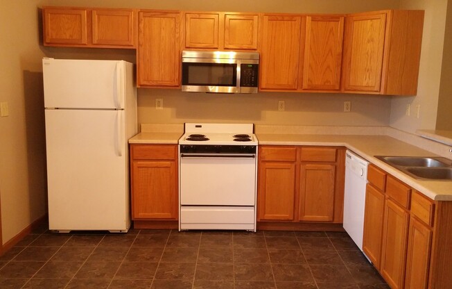 Spacious 2BD 2 BA duplex with 2 car attached garage. Just a few steps away from everything you need!