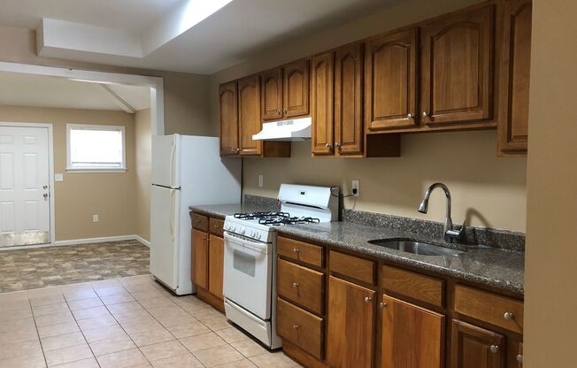 Great Home! 4 Bedrooms! Lots of Living Space! Updated Kitchen with Granite Counters! New Wood Flooring!