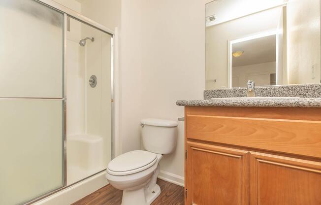 a kitchen with a sink and a mirror