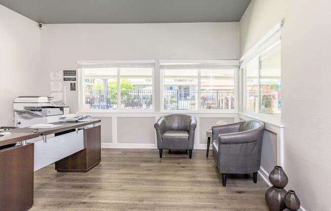 a room filled with furniture and a large window