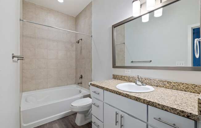 Bathroom with a bathtub and a sink The Monarch by Windsor, Austin, TX