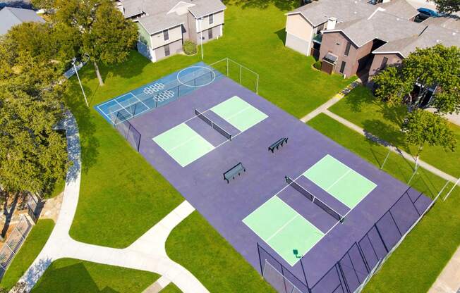 an aerial view of two pickle ball courts on a neighborhood court