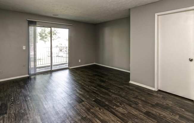 Remodeled living room with hardwood floor at Terrace Garden Townhomes