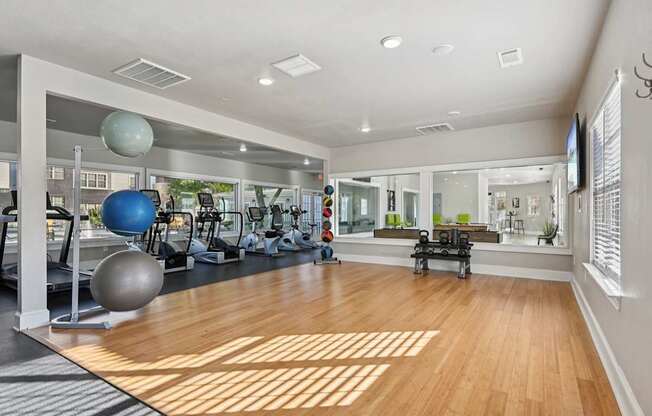 A gym with a variety of exercise equipment.
