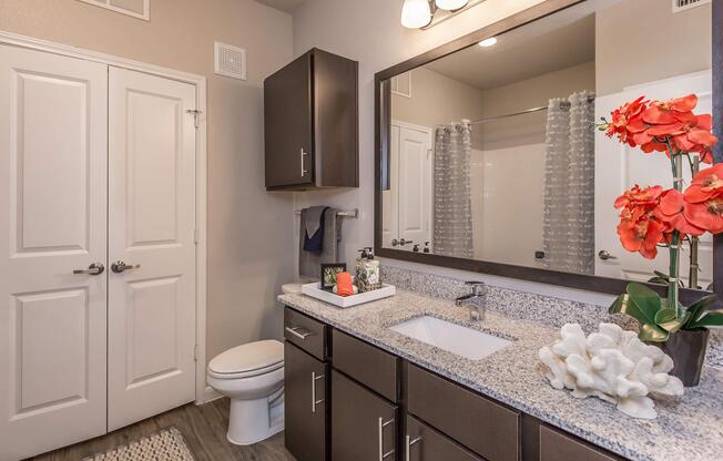 a kitchen with a sink and a mirror