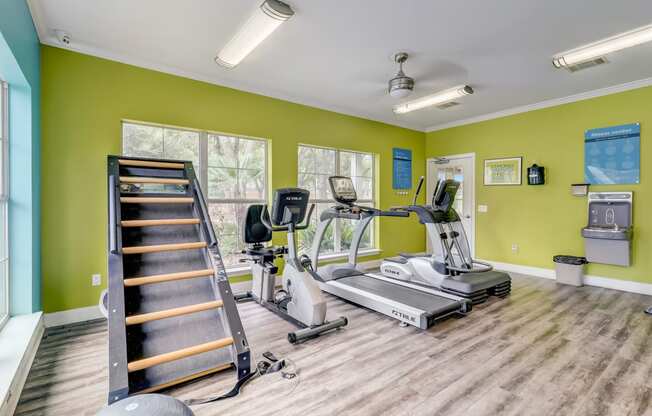 the gym with treadmills and weights at the commons on 54th