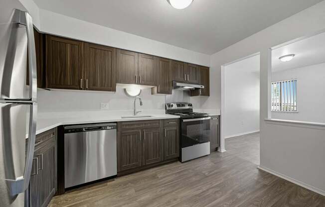 Modern kitchen with stainless steel appliances at Franklin River Apartments in Southfield, MI
