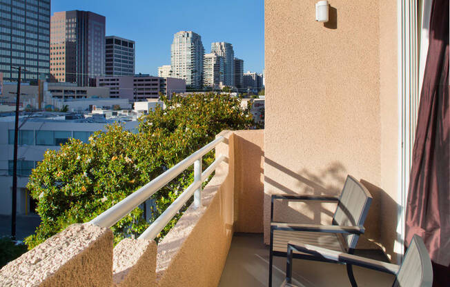 Apartment balcony with street and treetop views