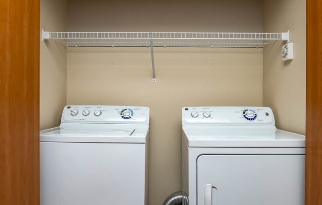 Full size side by side washer and dryer with shelf and storage