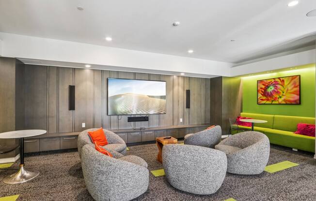 Common living room with grey chairs at Park77 Apartments, Massachusetts, 02138