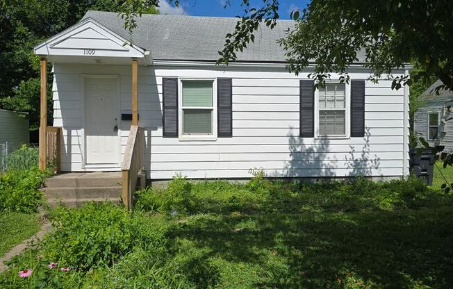 2 bd, 1 ba house, hardwoods, new paint, fenced with shed, w/d included, mowing provided, north central location near Business Loop