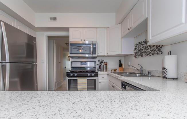 a stainless steel refrigerator in a kitchen