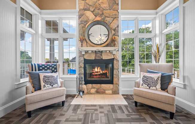 A cozy living room with a fireplace and two couches.