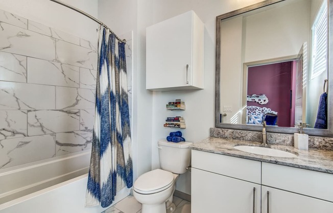Apartments for Rent Lewisville - Hebron 121 Station - Bathroom With Tile Flooring, Cabinets, and a Modern Shower