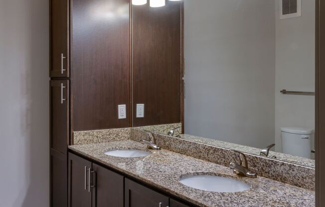 spacious bathroom with designer lighting and custom cabinetry at Artisan on 18th, Tennessee