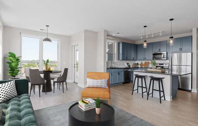 an open living room with a kitchen and a dining room