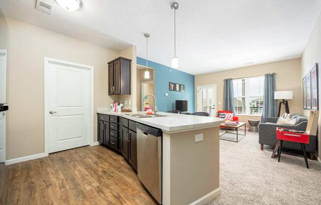 a kitchen and living room with a couch and a table