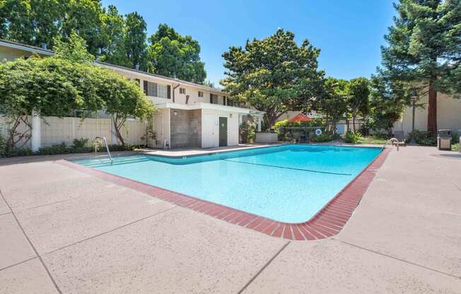 Apartments for Rent in San Jose CA - Los Gatos Creek - Pool with Poolside Restrooms Surrounded by Lush Landscaping