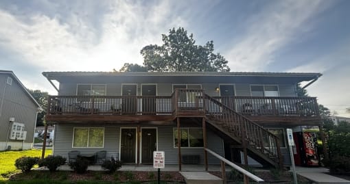 a building with a deck and stairs