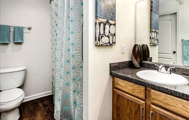 two pictures of a bathroom with a toilet and a sink