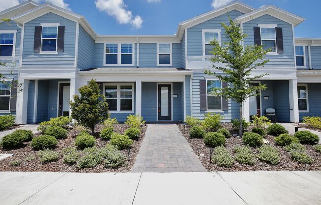 Beautiful 3/2.5 Modern Townhome with a Private Courtyard and a 2 Car Garage in the Gated Isles of Lake Nona - Orlando!