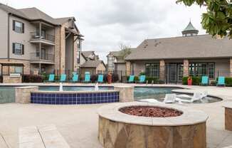 the preserve at ballantyne commons pool and spa with chairs and a fire pit