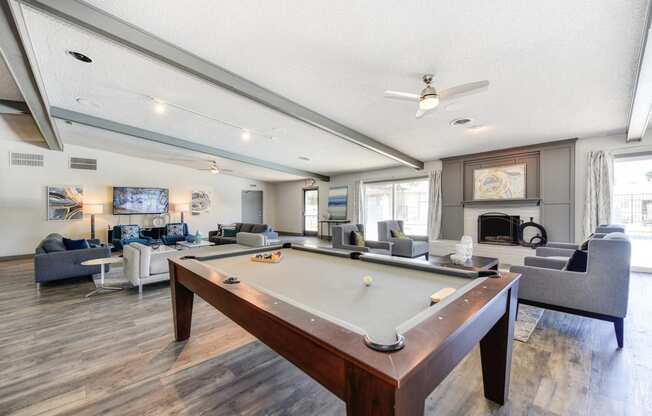 Clubhouse Sitting Area with Pool Table, Hardwood Inspired Floor, Gray and White Sofas