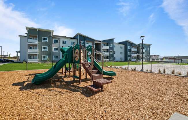 the preserve at ballantyne commons playground with slides and buildings