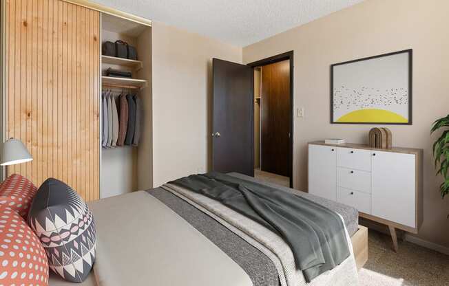 a bedroom with a bed and a closet