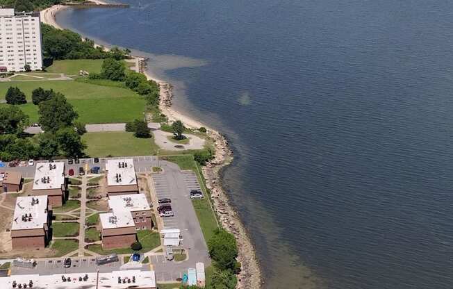 an aerial view of the shoreline of a beach and a body of water