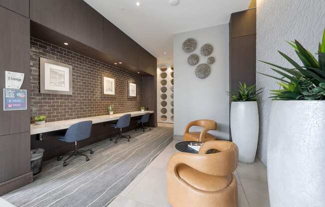 a reception area with a chair and a desk in a lobby