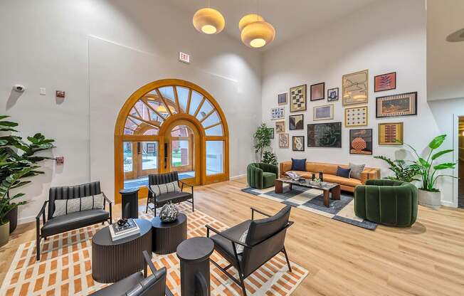 Lobby with chairs, pictures and high ceilings