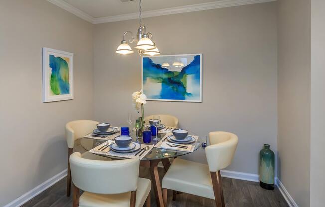 Set dining table with chairs at Ashley Oaks Apartments in Greensboro, North Carolina