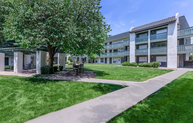 BBQ picnic area with bistro lighting at Treehouse Apartments in Albuquerque, New Mexico