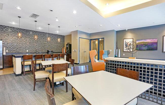 A dining room with a long table and chairs.