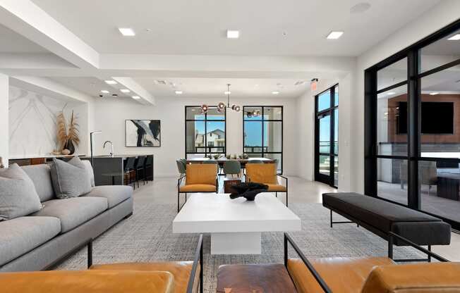 a living room with couches and chairs and a table