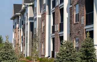 A row of houses with a sign that says Welcome Home.