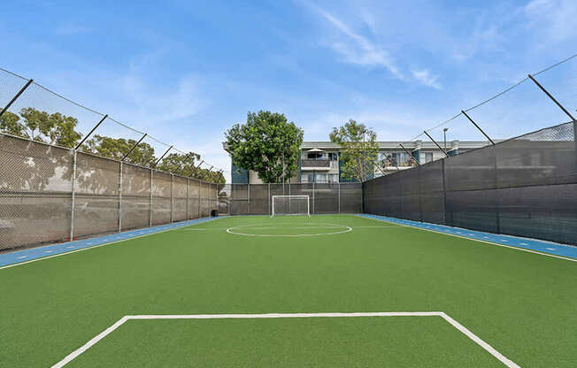 Community Soccer Field with Nets at Madison Park Apartments located in Anaheim, CA.