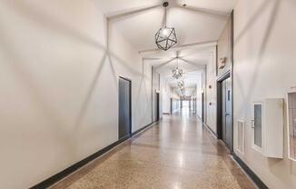 Tall ceilings newly refinished hallways at Crogman School Lofts, Georgia, 30315