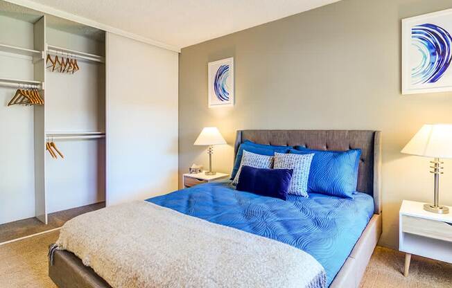 a bedroom with a bed and two night stands at The Bluffs at Mountain Park, Lake Oswego