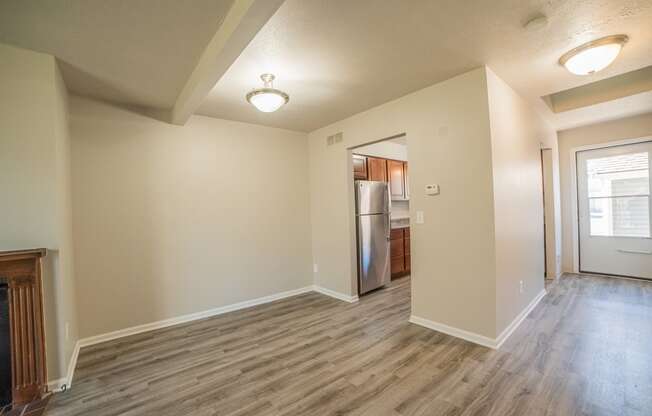 Spacious layout, dining room, kitchenand newly renovated wood floors at Westwind Townhomes in Lansing, Michigan